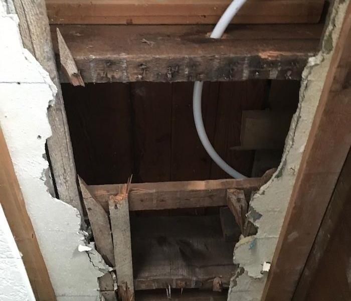 Ceiling with missing sheetrock and exposed framework