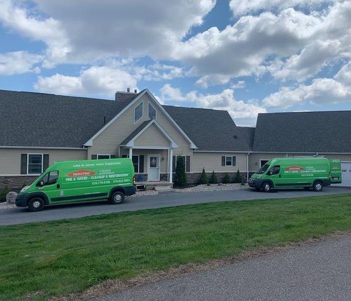 SERVPRO vehicles parked in front of home