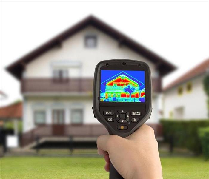 infrared camera hand-held point to a two story house