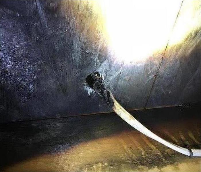 An electrical fire that started as a result of damaged wiring 
